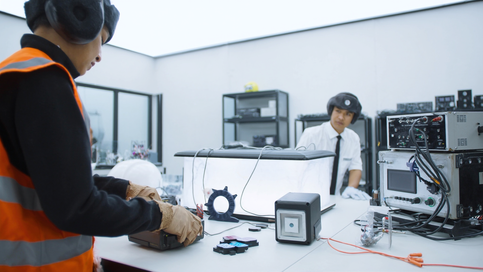 Technicians assessing a product in an Indonesian testing laboratory